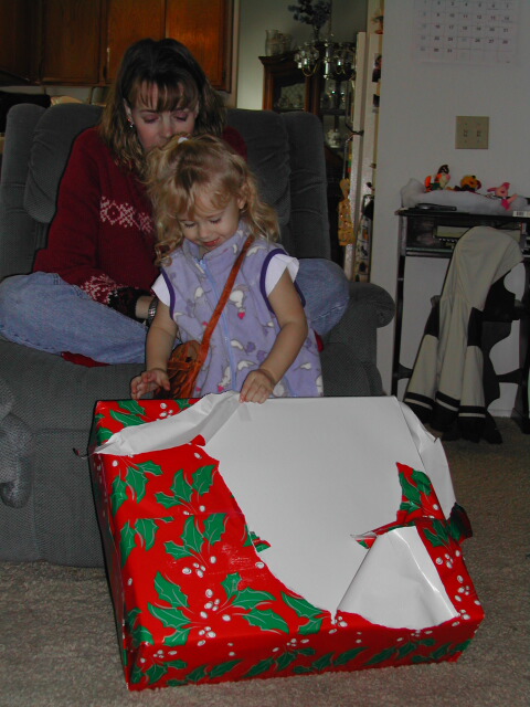 This one was bigger than her. I tried to convince everyone that you can't open presents that are bigger than you so this one should have been for me.